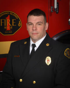 A photo of a firefighter in Class A uniform